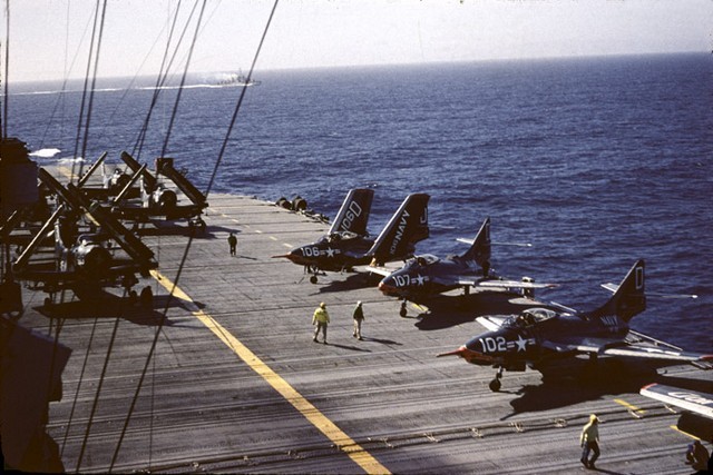 Mixed deck of Spotted Douglas AD-5's and F9F Cougars on the rear flight deck